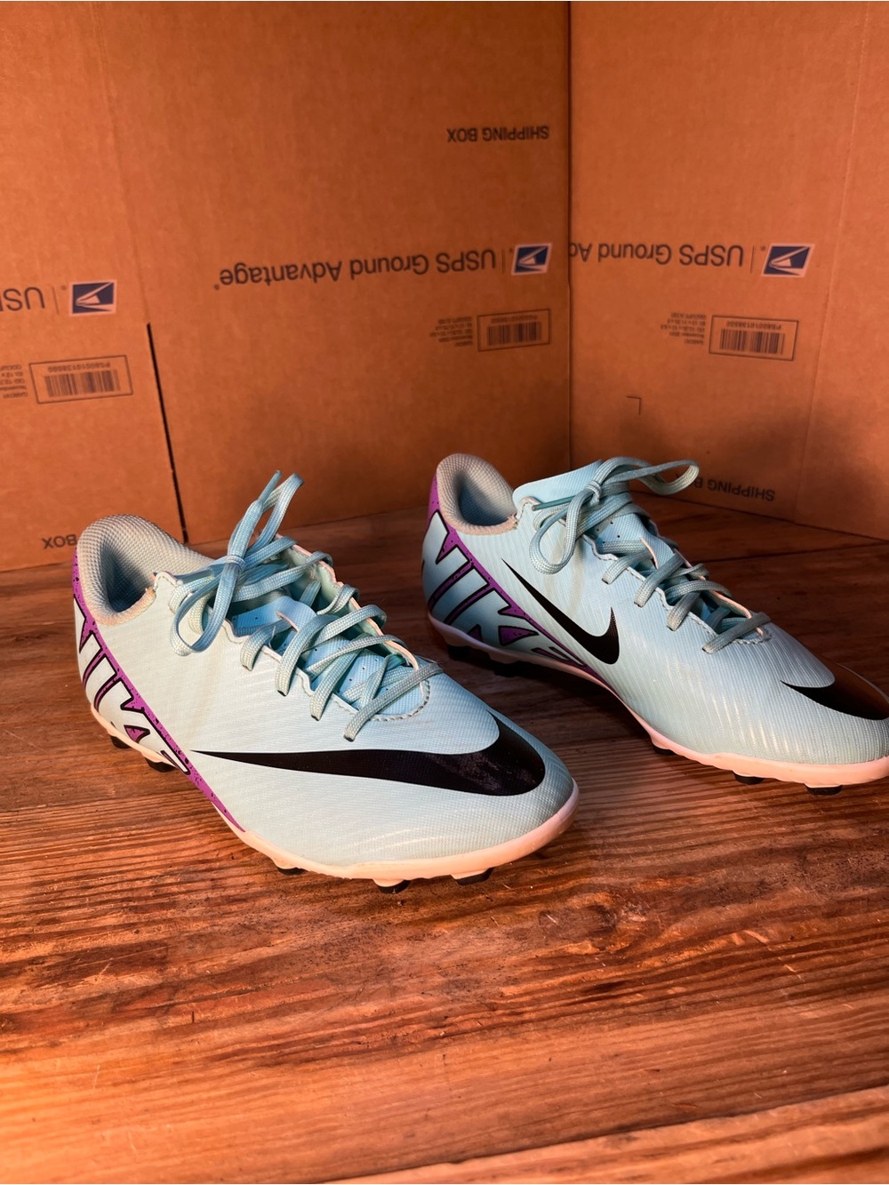 Nike Women's Light Blue Soccer Cleats with Black Swoosh and Purple Accents